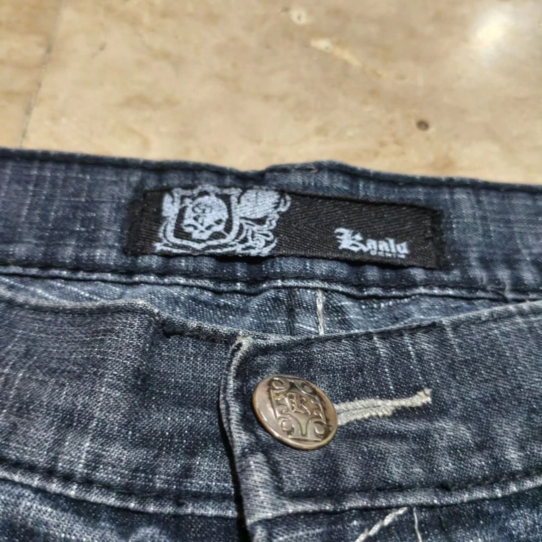 Koalu Denim Distressed Jean Shorts (Category: Shorts) located in Santa Rosa. Submitted by izxenjairr80094 (Listing ID 1466690886, Image 3). Description: - Brand: Koalu - Style: Knee-length denim jorts / streetwear - Wash: Dark wash with heavy distressing and whiskering - Details: Contrast stitching and unique patterns on back pockets - Hardware: Branded button closure and waist patch - Condition: Great pre-loved condition - .