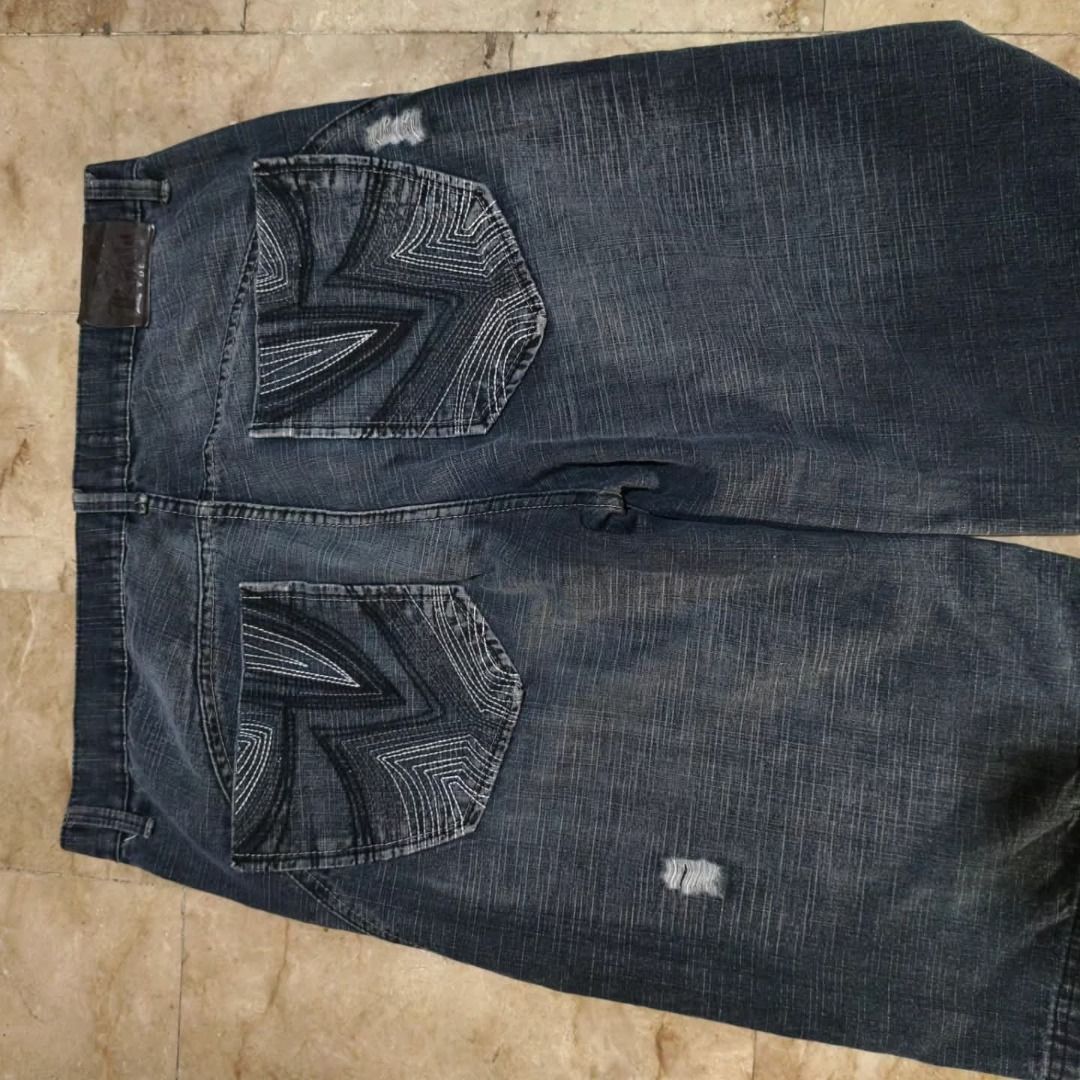 Koalu Denim Distressed Jean Shorts (Category: Shorts) located in Santa Rosa. Submitted by izxenjairr80094 (Listing ID 1466690886, Image 2). Description: - Brand: Koalu - Style: Knee-length denim jorts / streetwear - Wash: Dark wash with heavy distressing and whiskering - Details: Contrast stitching and unique patterns on back pockets - Hardware: Branded button closure and waist patch - Condition: Great pre-loved condition - .