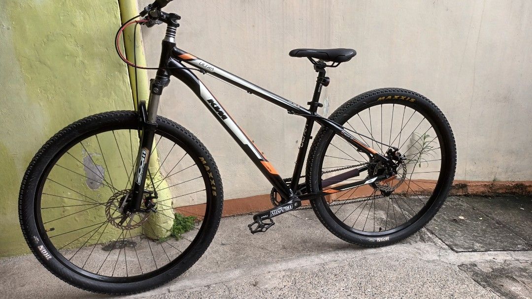 KTM Ultra Mountain Bike (Category: Bicycles) located in Manila. Submitted by fritz2 (Listing ID 1466712724, Image 1). Description: - Brand/Model: KTM Ultra Mountain Bike - Frame: Alloy 6061 (Black & Orange) - Suspension: Zoom fork 29er - Drivetrain: Truvativ crankset - Tires: Maxxis (Front & Rear) size 29 - Brakes: Front and rear mechanical disc brakes issues: some paint scratches but paint still shiny. suspension fork no bounce. - Condition: Rea