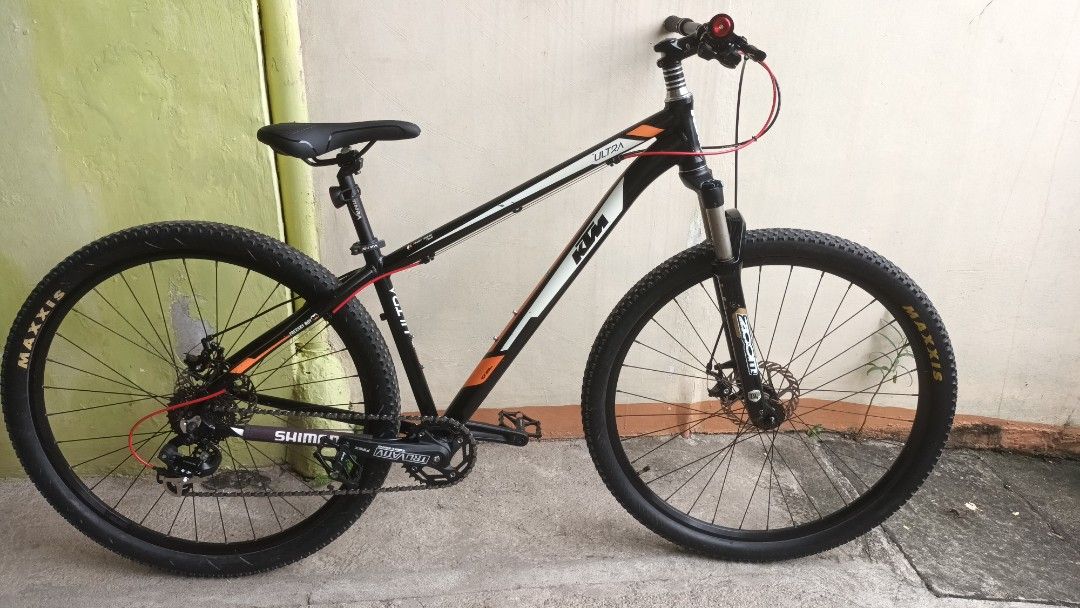KTM Ultra Mountain Bike (Category: Bicycles) located in Manila. Submitted by fritz2 (Listing ID 1466712724, Image 2). Description: - Brand/Model: KTM Ultra Mountain Bike - Frame: Alloy 6061 (Black & Orange) - Suspension: Zoom fork 29er - Drivetrain: Truvativ crankset - Tires: Maxxis (Front & Rear) size 29 - Brakes: Front and rear mechanical disc brakes issues: some paint scratches but paint still shiny. suspension fork no bounce. - Condition: Rea
