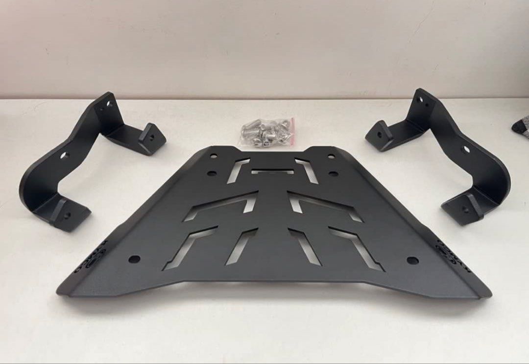 Kymco Motorcycle Top Box Rack Mounting Plate Kit (Category: Looking For) located in Paranaque City. Submitted by midnightsky777 (Listing ID 1466595775, Image 2). Description: - Authentic Kymco black metal top box base plate - Includes sturdy left and right support arms - Complete with mounting brackets and sealed hardware bag (bolts and nuts) - Durable construction featuring sleek geometric cutouts - Plug and play, ready for easy installation - M