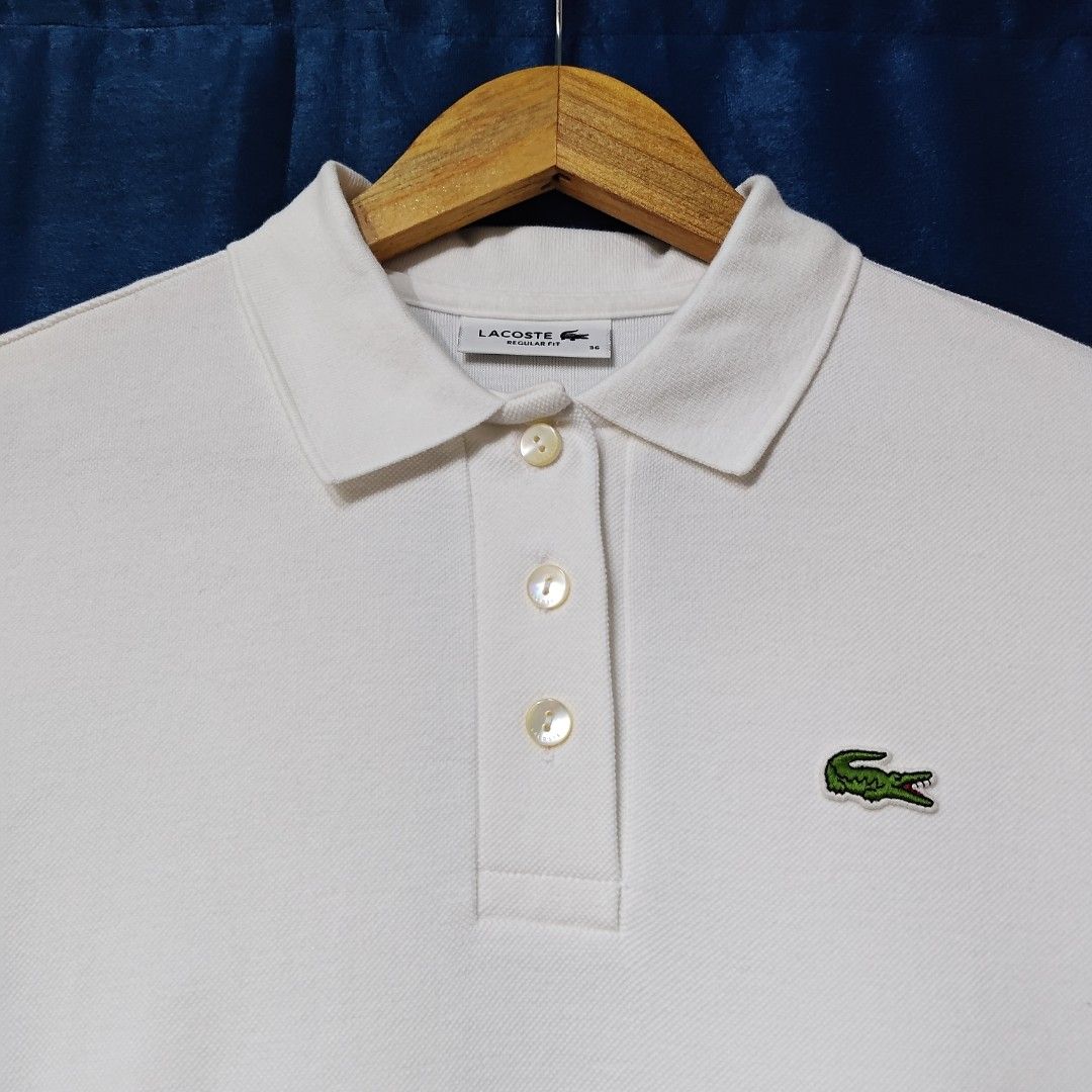 LACOSTE BASIC LOGO WHITE POLO SHIRT (Category: Others Tops) located in Makati City. Submitted by upcycled.closeth (Listing ID 1466612463, Image 2). Description: - Authentic Lacoste product - White/ short sleeve polo shirt - Size: medium to large (women's) - Like new - Authentic - flaws: no flaws - Excellent condition - Need wash, fresh from bale - Features design of Lacoste basic logo polo shirt - Material: 100% cotton !!STILL NEGOTIABLE!!.
