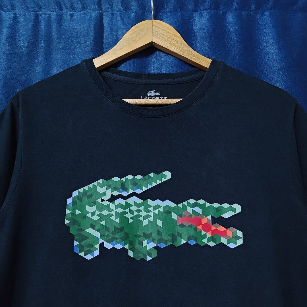 LACOSTE BIG LOGO TEE (Category: Tshirts & Polo Shirts ) located in Makati City. Submitted by upcycled.closeth (Listing ID 1466589629, Image 2). Description: - Authentic Lacoste product - Navy blue, short-sleeved - Size: Medium (men's) - Like new - Authentic - flaws: no flaws - Excellent condition - Need wash, fresh from bale - Features design of Lacoste biglogo tee - Material: 100% cotton !!STILL NEGOTIABLE!!.