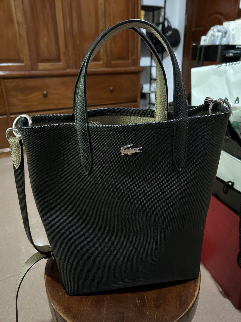 Lacoste Black and Beige Tote Bag (Category: Tote Bags) located in Alitagtag. Submitted by patrickvillanueva (Listing ID 1466626633, Image 1). Description: - Brand: Lacoste - Color: Black and beige - Material/Design: Structured textured exterior with silver-tone crocodile logo hardware - Straps: Dual top handles plus an adjustable, detachable shoulder strap - Interior: Beige pebble grain texture lining with an open compartment - Condition: Clean s