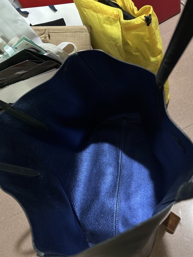 Lacoste Black Pure Leather Tote Bag (Category: Tote Bags) located in Alitagtag. Submitted by patrickvillanueva (Listing ID 1466619279, Image 3). Description: I bought this for ₱18,000+ at Lacoste Solaire. - Brand: Lacoste - Color: Black exterior with a contrasting metallic blue interior - Material: Genuine leather - Design: Minimalist style with front embossed crocodile logo, dual shoulder straps, and open top - Condition: Good, with minor scuffs