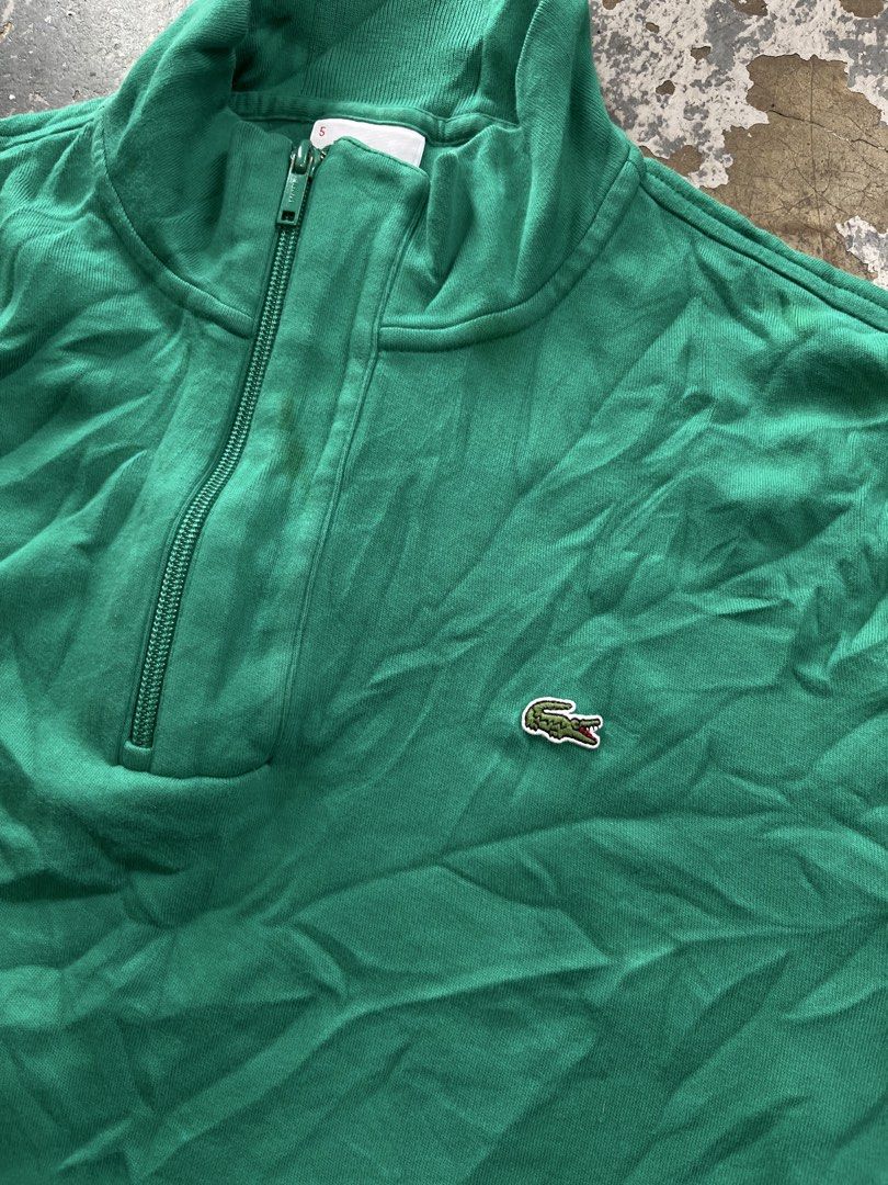 Lacoste Green Quarter Zip Sweatshirt Size 5 (Category: Coats, Jackets and Outerwear) located in Muntinlupa City. Submitted by cutiepie143 (Listing ID 1466664399, Image 2). Description: - Brand: Lacoste - Style: Quarter-zip sweatshirt (Style F8330) - Color: Green - Material: 100% Cotton - Size: Labeled Size 5 (Regular Fit) - Origin: Made in Peru by Devanlay - Details: High neck collar, matching green zipper pull, embroidered crocodile logo on left