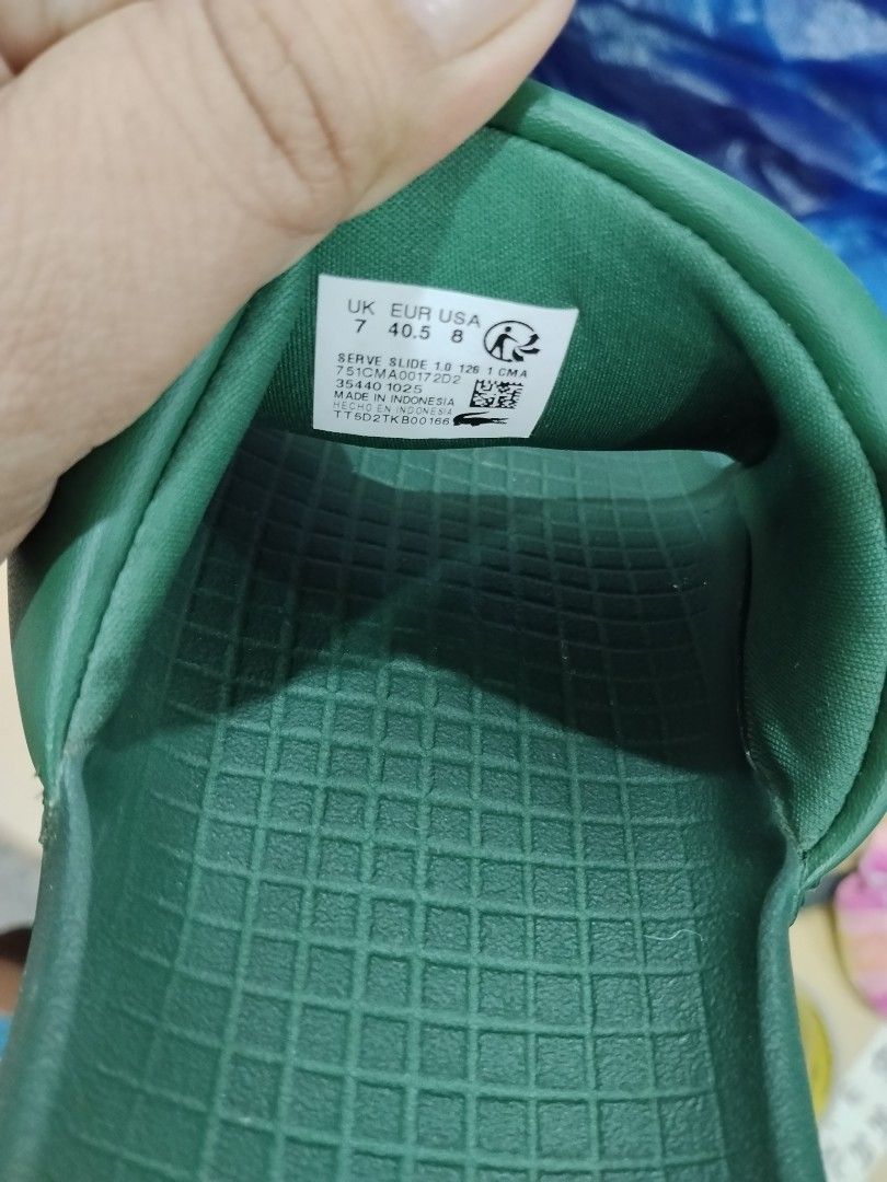 Lacoste Green Slides Sandals (Category: Slippers & Slides) located in Bulacan. Submitted by cjcshop22 (Listing ID 1466596218, Image 2). Description: - Brand: Lacoste - Color: Green with signature white crocodile logo - Condition:Excellent - Features: Comfortable textured grid footbed, easy slip-on style Original Lacoste Sleeper Original Lacoste sleeper, purchased from Solaire. Labeled size 9, but due to being exposed to sunlight over time, the ma