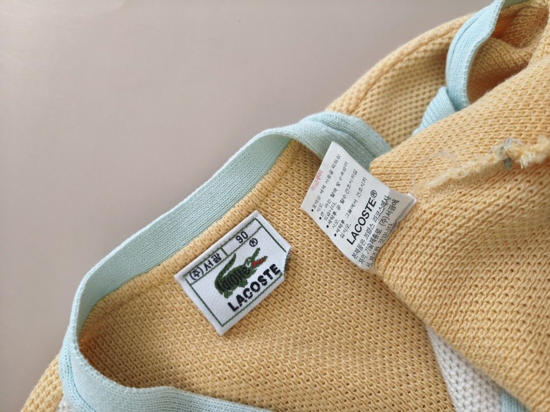 Lacoste Knit V-Neck Button Vest S-M (Category: Coats, Jackets and Outerwear) located in Cebu City. Submitted by little_mush.room (Listing ID 1466583762, Image 3). Description: - preloved Lacoste vintage knit vest - Design: Pastel colorblock (Yellow, cream, and light blue) - Neckline: V-neck with logo-debossed front buttons - Details: Signature embroidered crocodile logo on the chest - Size: Tag shows size 90 📍measurement posted for ur reference 
