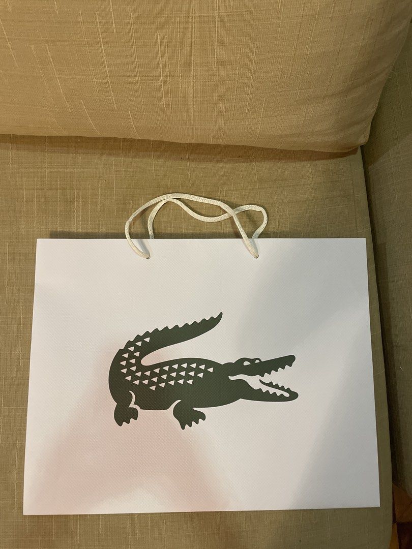 Lacoste Paper Bag (Category: Tote Bags) located in Cebu City. Submitted by kiki_closet168 (Listing ID 1466650146, Image 1). Description: Size 17.5in x 13.5in x 3in.