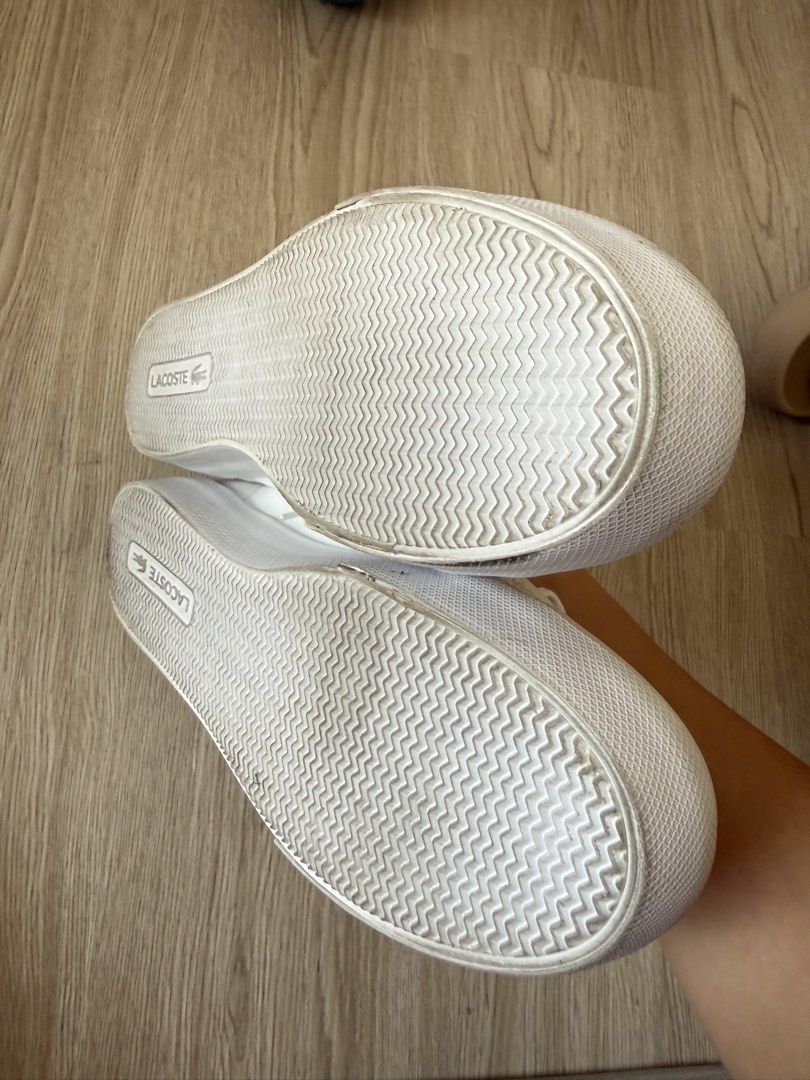 Lacoste White Leather Sneakers with Gold Hardware (Category: Sneakers) located in Rodriguez. Submitted by sheddmycloset (Listing ID 1466712363, Image 3). Description: - Authentic white leather Lacoste sneakers - Elegant gold hardware including eyelets and branded lace lock plates - Classic low-top design with durable rubber toe caps - Comfortable Ortholite insoles for all-day wear - Clean white laces and soles showing minimal signs of use.