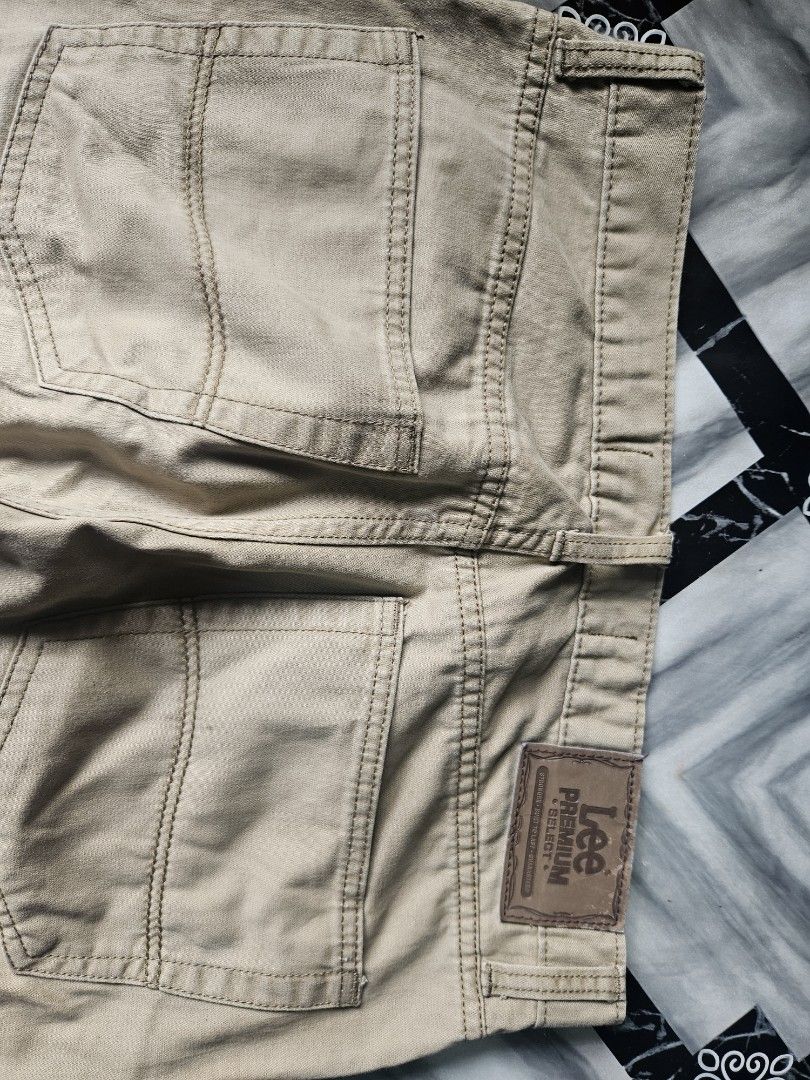 Lee Premium Select Khaki Regular Fit Pants (Category: Trousers) located in Manila. Submitted by shanshan.river (Listing ID 1466593225, Image 3). Description: - Brand: Lee Premium Select - Style: Regular fit with straight legs - Color: Versatile light brown / khaki - Material: Durable, high-quality cotton - Features: Classic five-pocket design, belt loops, button and zipper fly, and branded rear leather patch - Condition: Excellent, ready to wear.