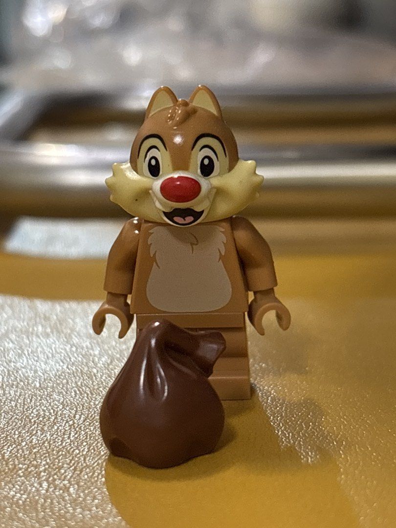 LEGO Disney Chip Minifigure with Nut Accessory (Category: Lego & Building Sets) located in Malabon City. Submitted by luxgoals (Listing ID 1466770066, Image 1). Description: - Authentic LEGO Disney Chip minifigure - Features signature red nose, buckteeth, and furry chest print - Comes with a brown nut/acorn accessory - Clean and well-kept in storage - Perfect addition to any Disney or LEGO collection.