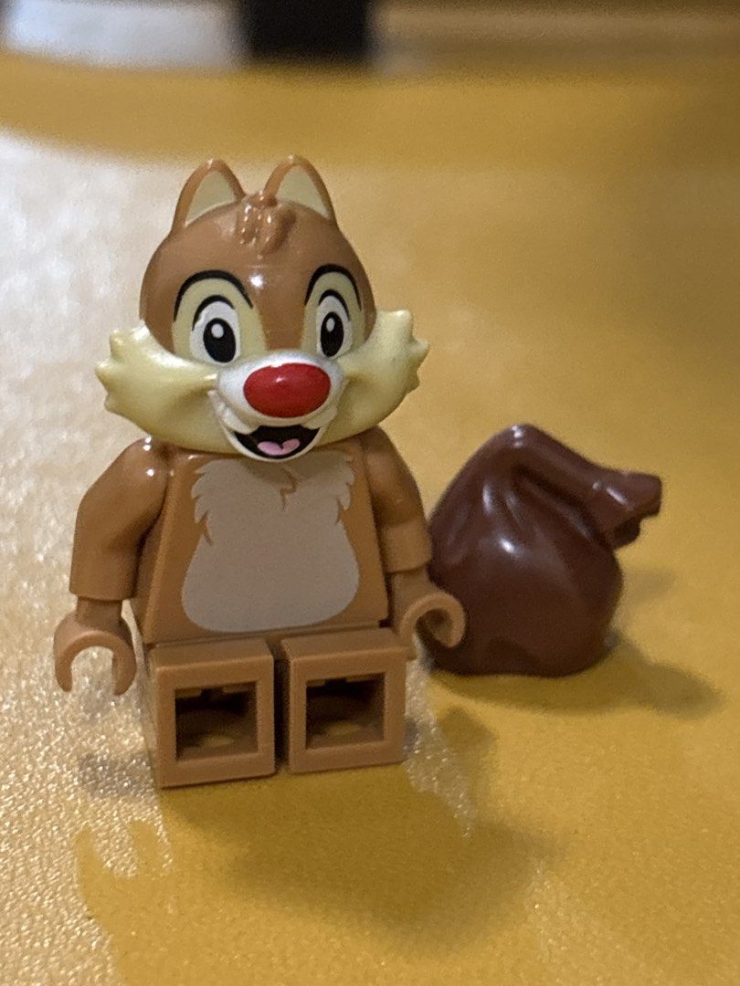 LEGO Disney Chip Minifigure with Nut Accessory (Category: Lego & Building Sets) located in Malabon City. Submitted by luxgoals (Listing ID 1466770066, Image 2). Description: - Authentic LEGO Disney Chip minifigure - Features signature red nose, buckteeth, and furry chest print - Comes with a brown nut/acorn accessory - Clean and well-kept in storage - Perfect addition to any Disney or LEGO collection.