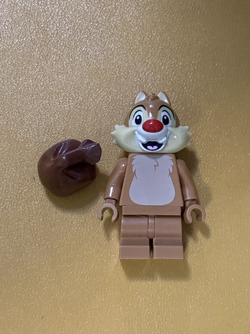 LEGO Disney Chip Minifigure with Nut Accessory (Category: Lego & Building Sets) located in Malabon City. Submitted by luxgoals (Listing ID 1466770066, Image 3). Description: - Authentic LEGO Disney Chip minifigure - Features signature red nose, buckteeth, and furry chest print - Comes with a brown nut/acorn accessory - Clean and well-kept in storage - Perfect addition to any Disney or LEGO collection.