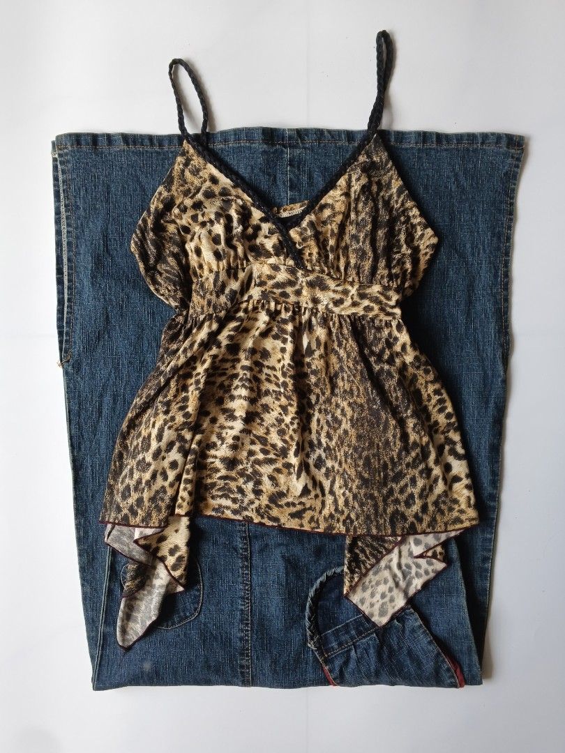 Leopard Print Camisole Spaghetti Strap Top Y2K (Category: Sleeveless) located in Batangas. Submitted by _mistybleu16 (Listing ID 1466617007, Image 1). Description: - Trendy leopard print camisole top - Stylish black braided spaghetti straps & V-neckline - Flattering empire waist with a flowy, asymmetrical handkerchief hem - Lightweight, silky-soft fabric for ultimate comfort - Versatile piece: great for layering or solo wear in warm weather - Mod