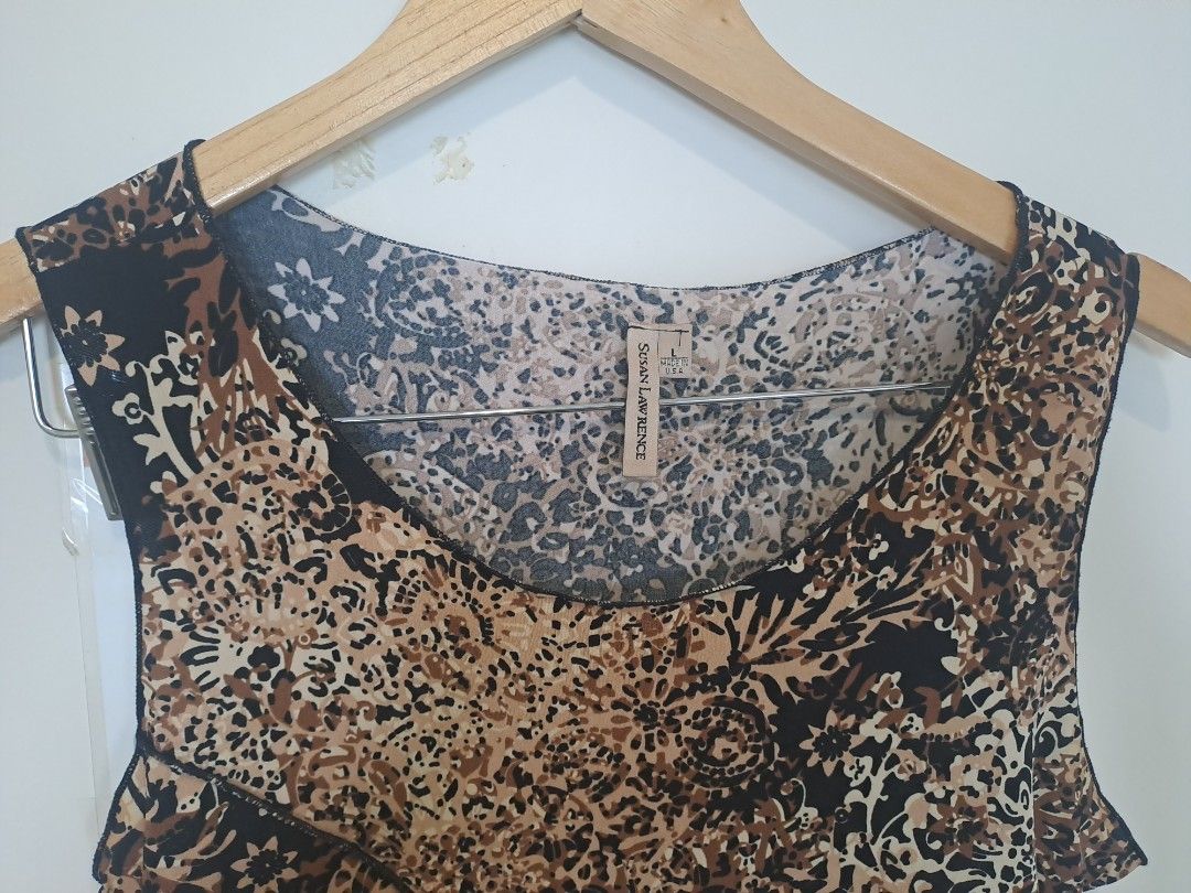 Leopard print sleeveless (Category: Sleeveless) located in Manila. Submitted by joanbalde39643 (Listing ID 1466664803, Image 2). Description: This is a y2k-style animal/leopard print tiered mesh tank top. It features a sleeveless scoop-neck design with subtle raw-edge ruffled tiers across the front body in warm earth tones of tan, brown, and black..