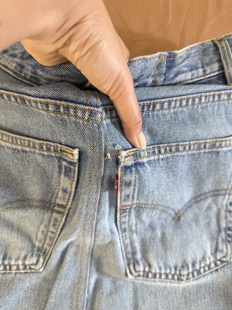 Levi's Denim Skirt (Category: Skirts) located in Pasay City. Submitted by cheyennesayson (Listing ID 1466573130, Image 2). Description: - Brand: Levi's - Wash: Medium blue denim - Fit: High-waisted with button fly - Details: Five-pocket styling, signature back pocket stitching, and raw frayed fringe hem - Condition: Great vintage look with minor wear near the back pocket seam (check photos) - Styling: Perfect for pairing with your favorite tees o