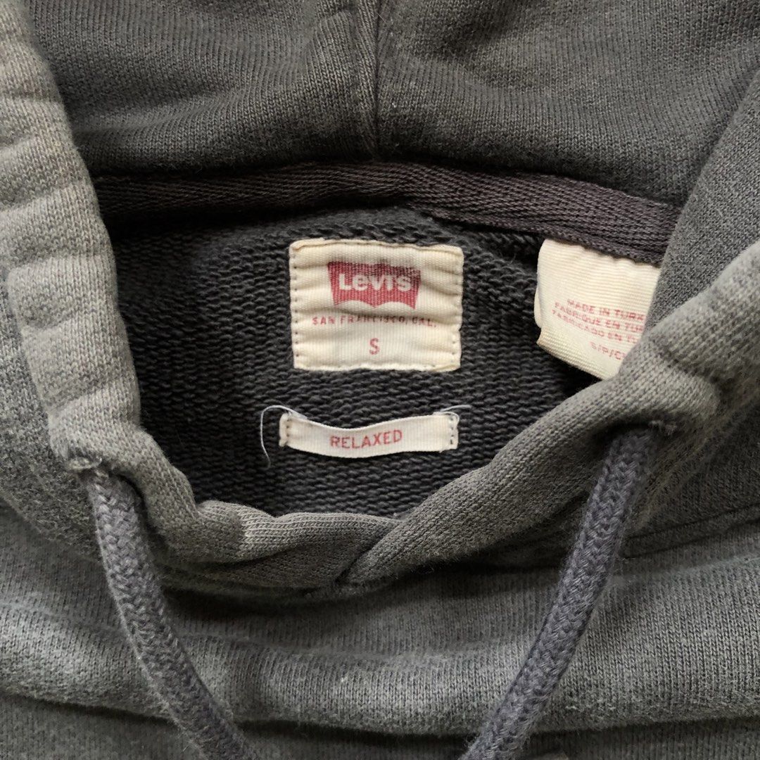 Levi's Heavy Hoodie (Category: Hoodies) located in Manila. Submitted by dopethrift.cat (Listing ID 1466613953, Image 2). Description: Dimension: Inches Width: 21" Length: 26" Sleeve: 22" Hood: 14" mop: gcash ship: lalamove or jnt - Brand: Levi's - Style: Heavy hoodie with relaxed fit - Size: Small (S) - Color: Dark grey with gold/shimmery Levi's chest logo - Material: Thick, warm, and durable fleece/cotton blend - Condition: Well-maintained, exce