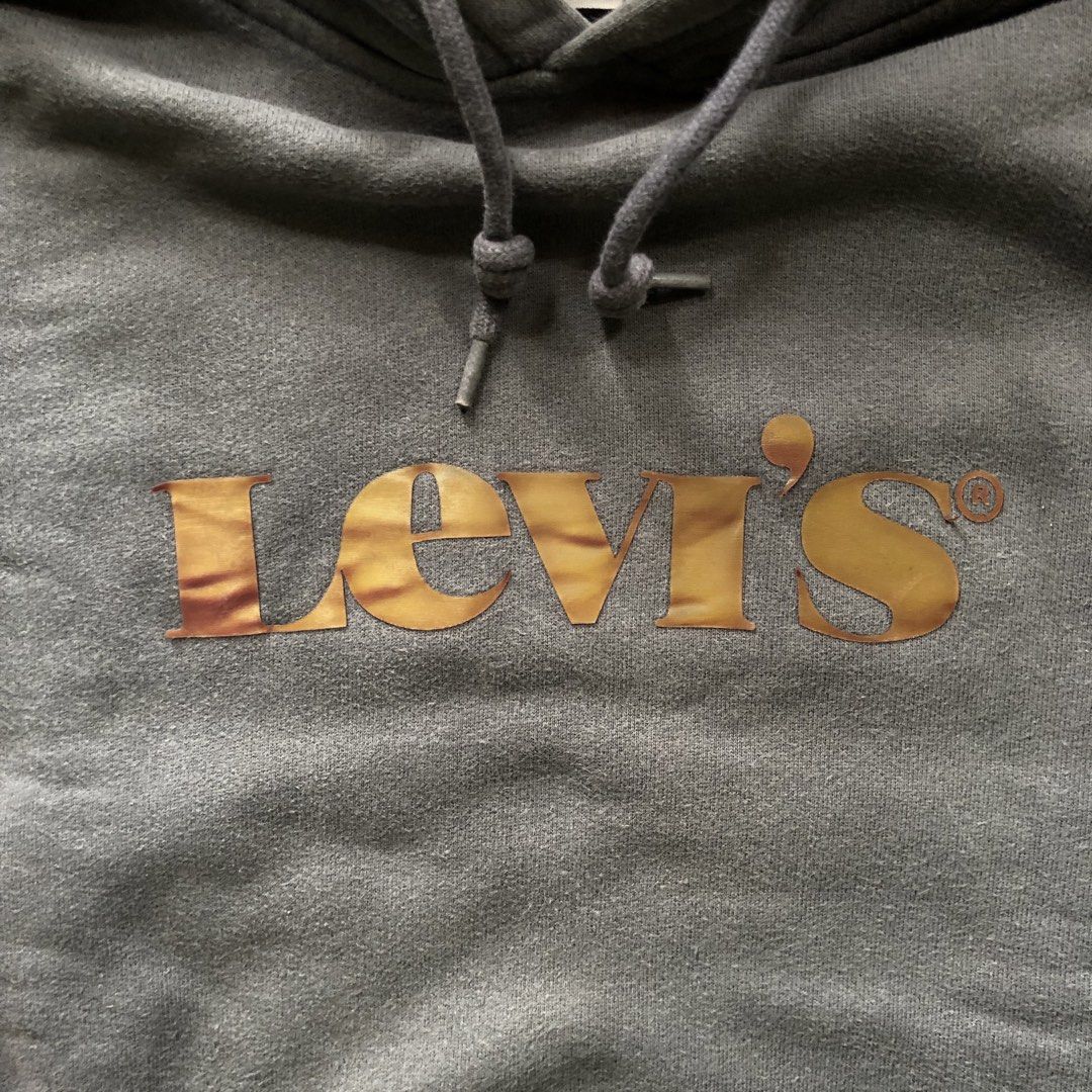 Levi's Heavy Hoodie (Category: Hoodies) located in Manila. Submitted by dopethrift.cat (Listing ID 1466613953, Image 3). Description: Dimension: Inches Width: 21" Length: 26" Sleeve: 22" Hood: 14" mop: gcash ship: lalamove or jnt - Brand: Levi's - Style: Heavy hoodie with relaxed fit - Size: Small (S) - Color: Dark grey with gold/shimmery Levi's chest logo - Material: Thick, warm, and durable fleece/cotton blend - Condition: Well-maintained, exce