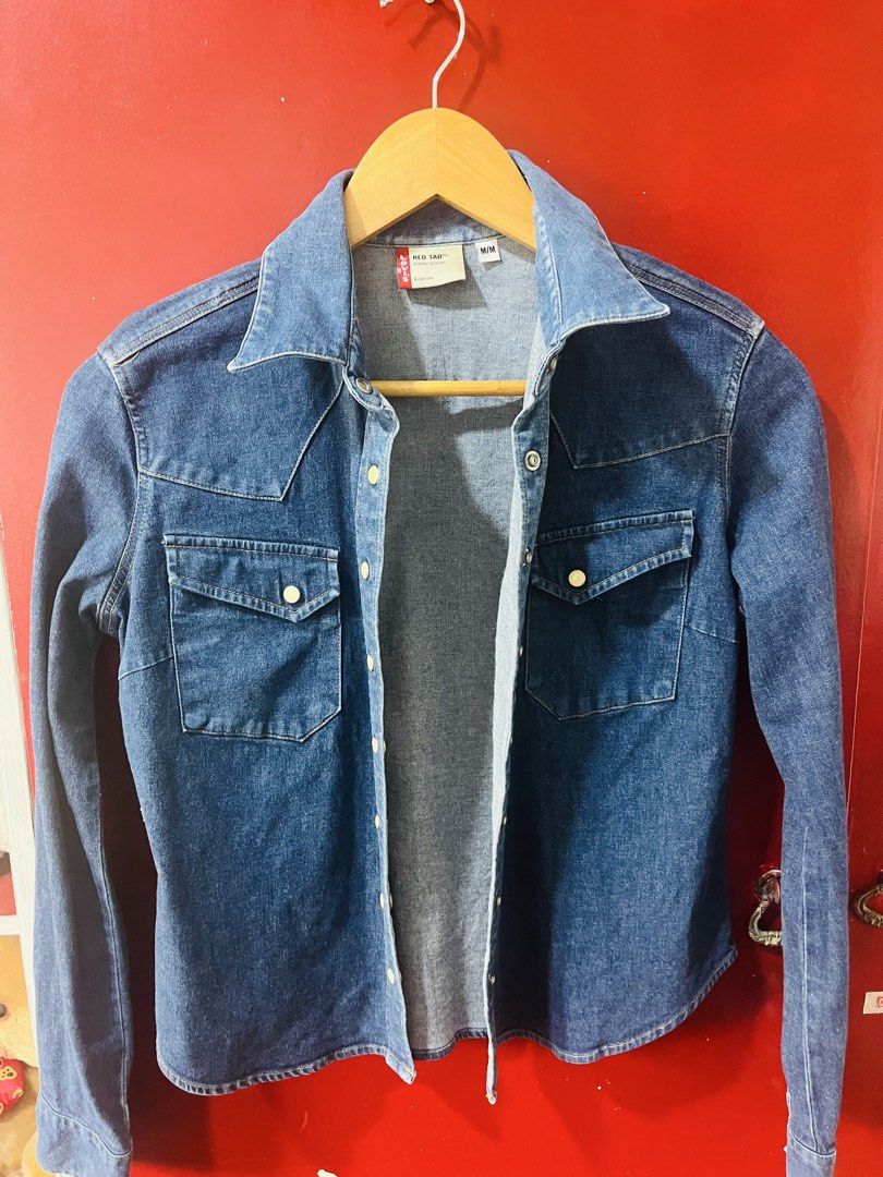 Levi's Red Tab Denim Western Shirt (Category: Coats, Jackets and Outerwear) located in Quezon City. Submitted by wacpon_061972 (Listing ID 1466590458, Image 1). Description: Levi’s Red Tab Denim Western Shirt. It features a classic mid-wash indigo denim fabrication accented by iconic Western design choices, including a pointed shoulder yoke, snap-button front closure, and double chest pockets with pointed flap snaps..
