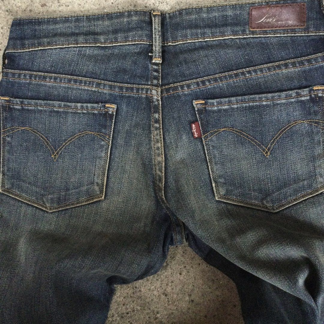 Levi's Slight Curve — Straight Leg Red Tab (Category: Jeans) located in Binangonan. Submitted by ininnep (Listing ID 1466764287, Image 3). Description: Brand: Levi's (Levi Strauss & Co.) Item Details: • Style: Levi's Slight Curve — Straight Leg • Size: W25 L32 (25 waist, 32 length) • Origin: Made in Indonesia • Color: Dark blue wash with subtle fading/distressing • Features: Classic Levi's leather patch, red tab, signature arcuate stitching on ba