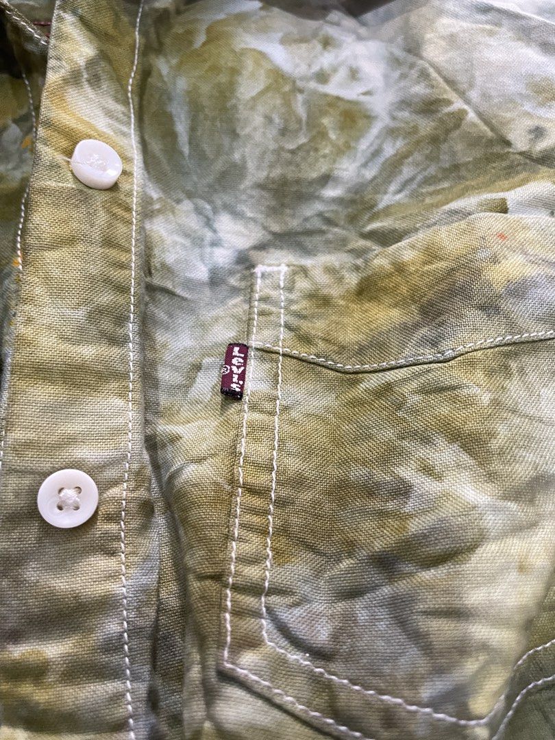 Levi's Tie-Dye Long Sleeve Button-Up Shirt (Category: Longsleeves) located in Dinalupihan. Submitted by maple.apparel (Listing ID 1466610148, Image 3). Description: - Brand: Levi's - Style: Long sleeve button-up shirt with green and white tie-dye pattern - Size: Medium - Details: Collared neckline, front button closure, single chest pocket with red Levi's tab, button cuffs, and standard curved hem - Origin: Made in India - Condition: Perfect, eas
