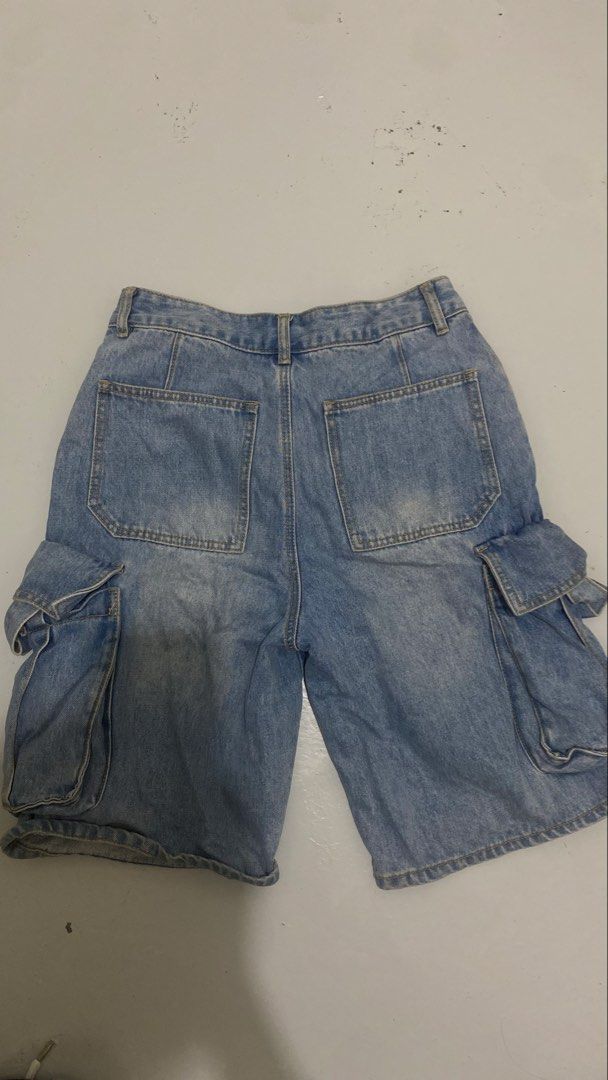Light blue denim cargo shorts with multiple utility pockets (Category: Shorts) located in Manila. Submitted by isthissnoopy (Listing ID 1466739085, Image 2). Description: - Style: Classic Y2K streetwear vibe, perfect for summer - Color/Wash: Light wash blue - Fit: Mid-rise waist with belt loops and button closure - Features: Multiple side utility pockets and an extra small front pocket - Condition: Great casual piece for everyday wear.
