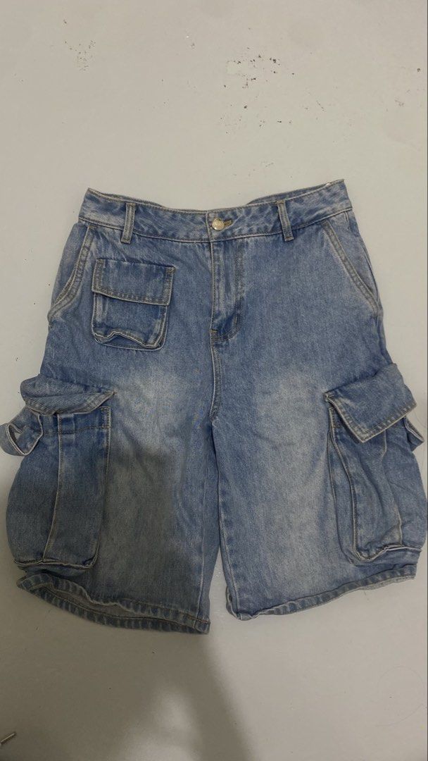 Light blue denim cargo shorts with multiple utility pockets (Category: Shorts) located in Manila. Submitted by isthissnoopy (Listing ID 1466739085, Image 1). Description: - Style: Classic Y2K streetwear vibe, perfect for summer - Color/Wash: Light wash blue - Fit: Mid-rise waist with belt loops and button closure - Features: Multiple side utility pockets and an extra small front pocket - Condition: Great casual piece for everyday wear.