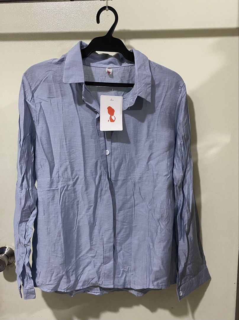 Light Blue Long Sleeve Button Down Shirt Blouse (Category: Longsleeves) located in Manila. Submitted by divinemercy_29 (Listing ID 1466643414, Image 1). Description: - Color: Light blue - Style: Long-sleeve button-down with classic collar - Condition: Brand new with original tag attached - Details: Front button closure and buttoned cuffs - Fabric: Soft and comfortable texture -Never worn .