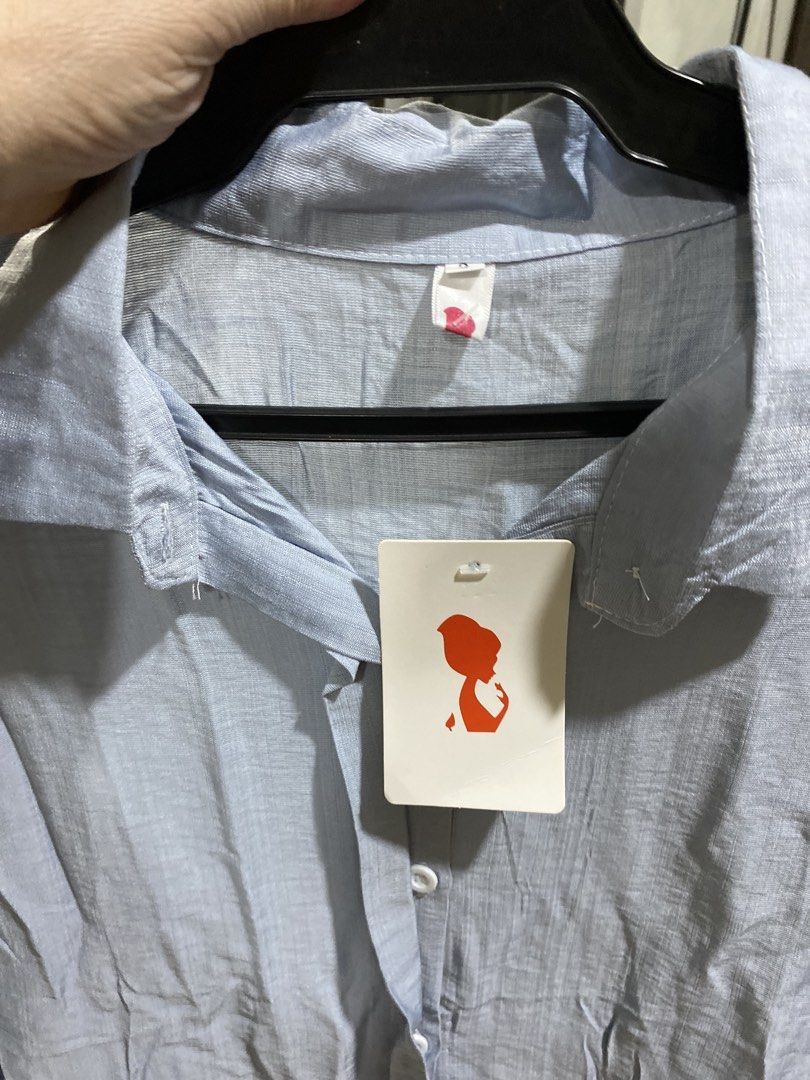 Light Blue Long Sleeve Button Down Shirt Blouse (Category: Longsleeves) located in Manila. Submitted by divinemercy_29 (Listing ID 1466643414, Image 3). Description: - Color: Light blue - Style: Long-sleeve button-down with classic collar - Condition: Brand new with original tag attached - Details: Front button closure and buttoned cuffs - Fabric: Soft and comfortable texture -Never worn .