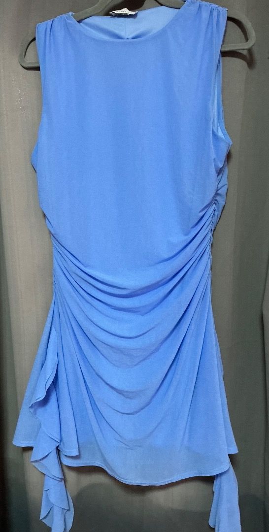 Light Blue Sleeveless Ruched Mini Dress (Category: Dresses) located in Pasig City. Submitted by kpieces.ph (Listing ID 1466620645, Image 1). Description: - Color: Light blue - Style: Sleeveless dress with scoop neckline - Details: Ruched sides and asymmetrical ruffled hem - Fit: Lightweight fabric with plenty of stretch for a great drape - Occasion: Ideal for parties, nights out, and casual dates.