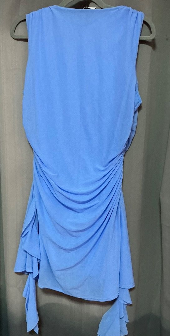 Light Blue Sleeveless Ruched Mini Dress (Category: Dresses) located in Pasig City. Submitted by kpieces.ph (Listing ID 1466620645, Image 2). Description: - Color: Light blue - Style: Sleeveless dress with scoop neckline - Details: Ruched sides and asymmetrical ruffled hem - Fit: Lightweight fabric with plenty of stretch for a great drape - Occasion: Ideal for parties, nights out, and casual dates.