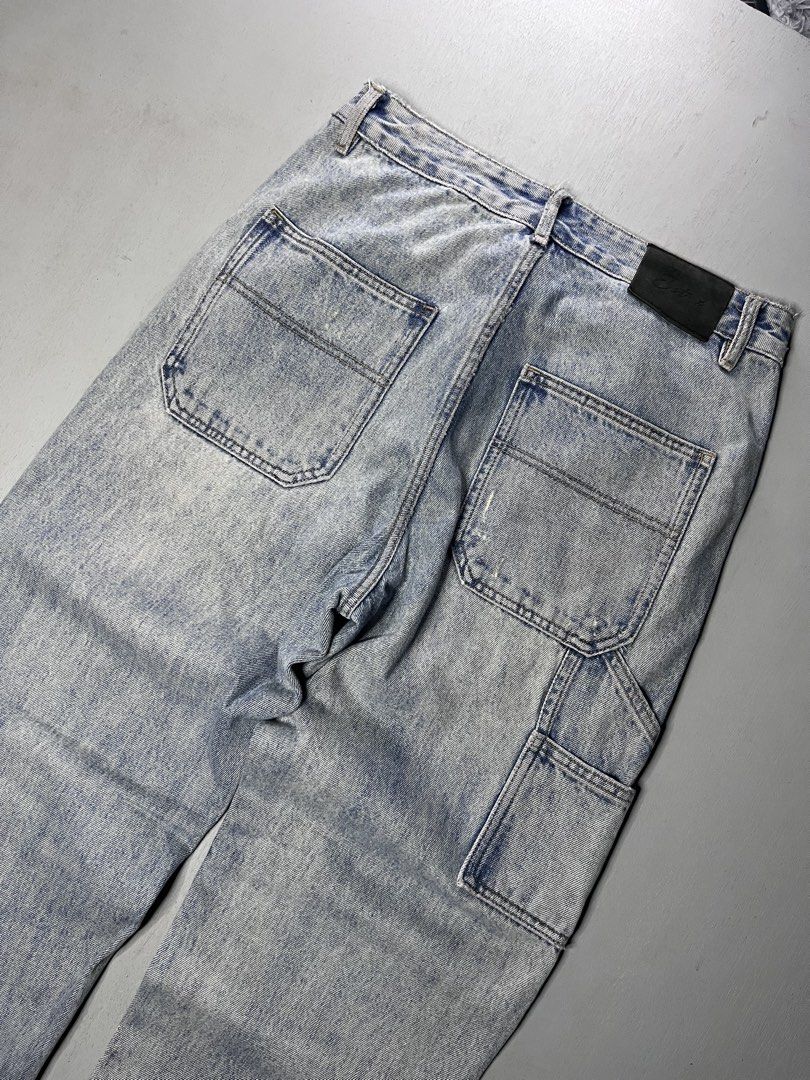 Light wash carpenter denim jeans with distressed hems (Category: Jeans) located in Catbalogan. Submitted by yellfindss (Listing ID 1466751021, Image 2). Description: - Style: Streetwear relaxed fit carpenter jeans -30-32/41 lo 7 - Wash: Light wash denim - Details: Double-knee panels, utility pockets, and a back leather patch - Finishing: Distressed front panels and frayed hems.