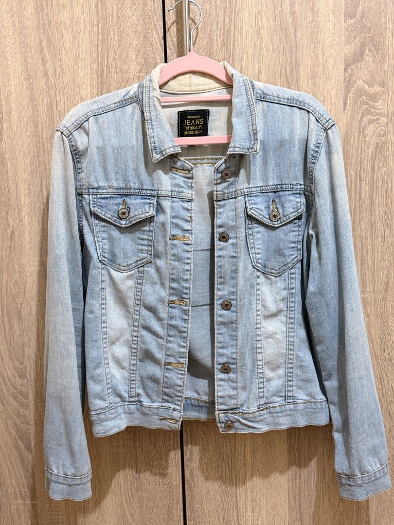 Light wash denim jacket button up outerwear (Category: Coats, Jackets and Outerwear) located in Manila. Submitted by anj_1414 (Listing ID 1466768259, Image 1). Description: - Light wash denim jacket with metal button closures - Dual chest pockets with flaps for a classic look - Timeless collar neckline and structured stitching - Faded wash pattern on the front and sleeves - Standard fit, ideal for effortless everyday layering.