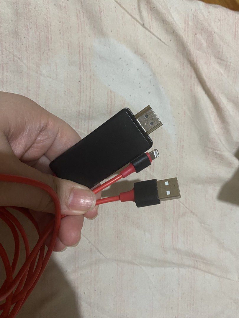 Lightning to HDMI Adapter Cable Red (Category: Cables & Adaptors) located in Manila. Submitted by darleenara75642 (Listing ID 1466698149, Image 3). Description: - Red Lightning to HDMI adapter cable with built-in USB power connector - Easily connects iPhone or iPad directly to TVs, projectors, or monitors - Features a durable, long red cable for flexible setup - Tested and 100% working condition - Perfect for streaming movies, viewing photos, or 