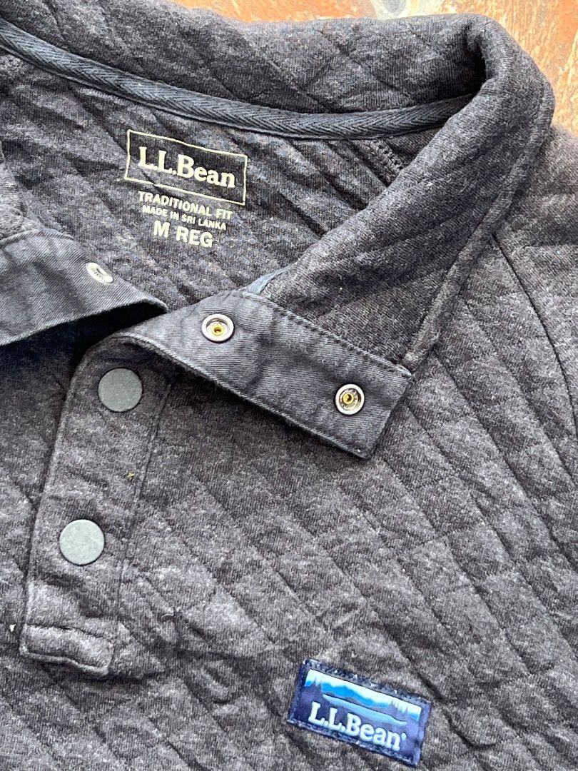 L.L. Bean Quilted Snap Pullover Sweatshirt Dark Grey Size M (Category: Coats, Jackets and Outerwear) located in Caloocan City. Submitted by sillapwet0606 (Listing ID 1466568055, Image 2). Description: - Brand: L.L. Bean - Style: Quilted pullover sweatshirt with snap button placket - Color: Dark Grey - Size: Medium - Material: 80% Cotton, 20% Polyester - Details: Small chest logo patch, ribbed cuffs and hem - Origin: Made in Sri Lanka - Item ID: 5