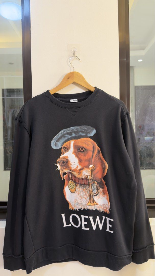 Loewe Black Dog Print Sweatshirt (Category: Coats, Jackets and Outerwear) located in Paranaque City. Submitted by preluxeshop_ph (Listing ID 1466768386, Image 2). Description: Loewe Black Dog Print Sweatshirt - Features a cool dog graphic on the front - Loewe logo detail at the bottom -Condition: 9.8/10 -Dimes: Length: 28” Width: 23”.