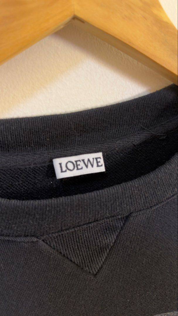 Loewe Black Dog Print Sweatshirt (Category: Coats, Jackets and Outerwear) located in Paranaque City. Submitted by preluxeshop_ph (Listing ID 1466768386, Image 3). Description: Loewe Black Dog Print Sweatshirt - Features a cool dog graphic on the front - Loewe logo detail at the bottom -Condition: 9.8/10 -Dimes: Length: 28” Width: 23”.