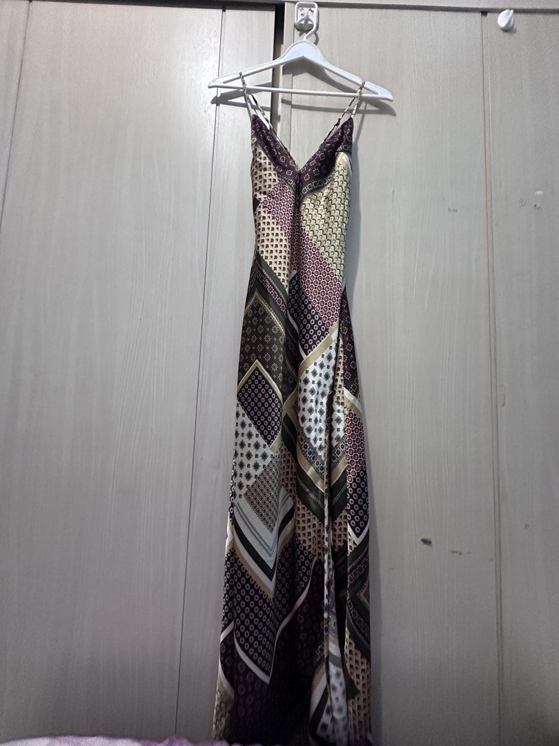Maxi Long Patchwork Pattern Slip Dress (Category: Dresses) located in Quezon City. Submitted by yani_gleich (Listing ID 1466711340, Image 1). Description: * Style: Long maxi dress with thin spaghetti straps and a flattering V-neckline * Design: Mixed patchwork featuring geometric and traditional-inspired patterns * Colorway: Rich shades of burgundy, olive green, cream, and brown * Material: Smooth satin-like fabric with a gorgeous, flowy drape * 