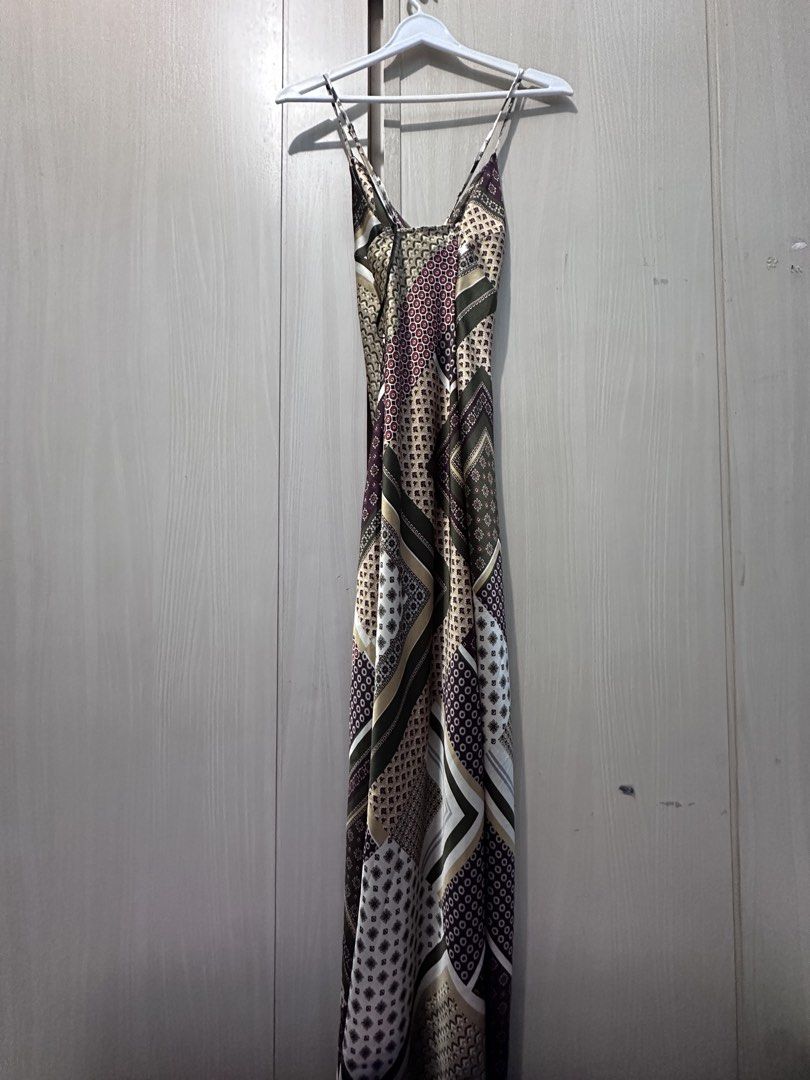 Maxi Long Patchwork Pattern Slip Dress (Category: Dresses) located in Quezon City. Submitted by yani_gleich (Listing ID 1466711340, Image 3). Description: * Style: Long maxi dress with thin spaghetti straps and a flattering V-neckline * Design: Mixed patchwork featuring geometric and traditional-inspired patterns * Colorway: Rich shades of burgundy, olive green, cream, and brown * Material: Smooth satin-like fabric with a gorgeous, flowy drape * 