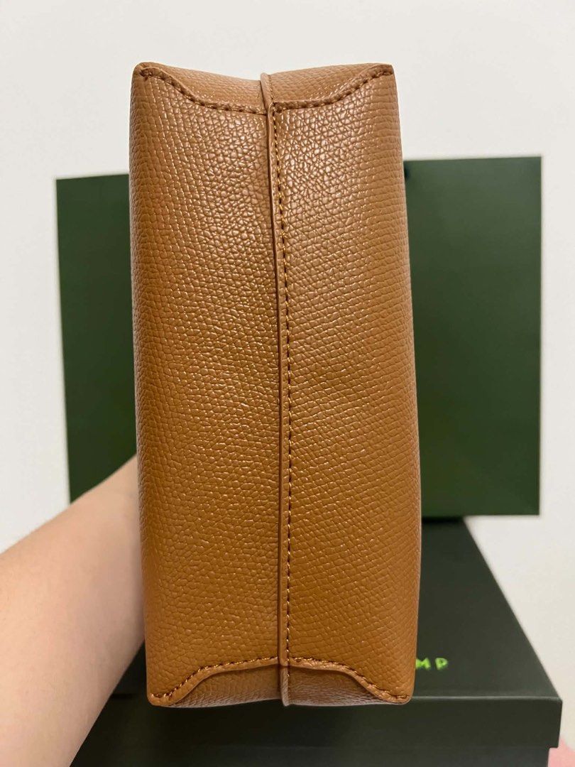 Longchamp Roseau Top Handle Bag (Category: Luxury Bags & Wallets) located in Abulug. Submitted by jamiecammie (Listing ID 1466701205, Image 3). Description: - Authentic Tan Leather Longchamp Roseau Bag - Structured design with signature silver-tone bamboo toggle closure - Includes matching detachable shoulder strap and top handles - Interior features zippered pocket with racing horse logo plaque - Comes complete with original green box and paper 