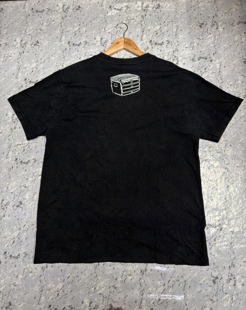Louis Vuitton Graphic T-Shirt Black (Category: Activewear) located in Manila. Submitted by raven236 (Listing ID 1466721005, Image 2). Description: - Brand: Louis Vuitton - Color: Deep black with maintained color - Fit: Regular fit, short-sleeve crewneck - Design: White tools graphic and brand lettering on front - Detail: Small white trunk graphic near the upper back collar - Condition: Clean, well-maintained overall.