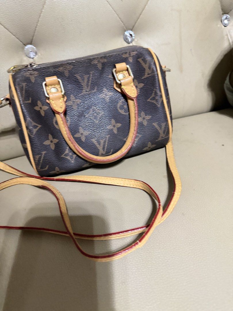 Louis Vuitton Monogram Nano Speedy Bag (Category: Luxury Bags & Wallets) located in Bayambang. Submitted by jiji_mel98 (Listing ID 1466726872, Image 1). Description: - Iconic brown monogram canvas with elegant tan leather trim - Secure top zipper closure with polished gold-tone hardware - Spacious interior featuring soft brown fabric lining and a signature tag - Includes an adjustable and detachable long shoulder strap for versatile wear - Compac