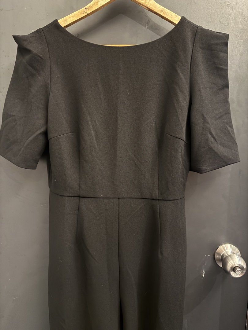 Love Bonito Black Jumpsuit (Category: Jumpsuits) located in Makati City. Submitted by 099baby (Listing ID 1466694377, Image 3). Description: Brand new Love Bonito black jumpsuit in Size M (UK 10 / US 6) with tag attached. Features short sleeves, padded shoulders, straight-cut pants, and a V-neck back with a concealed zip. 🤍 Originally bought on the Love Bonito website for PHP2,869 🤍 With a hole (maybe 2 inches big) but can easily be fixed — as 
