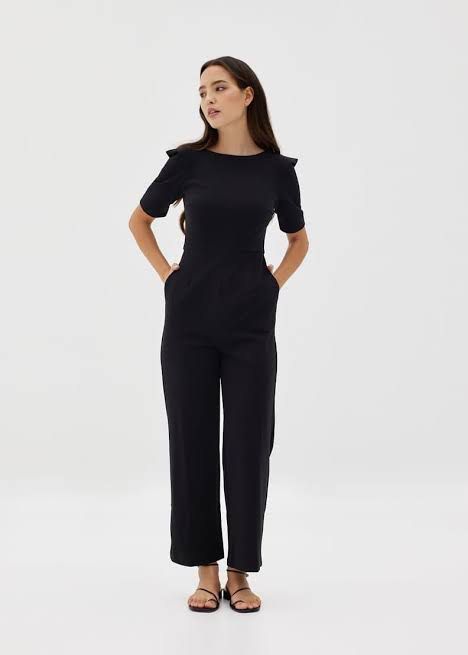 Love Bonito Black Jumpsuit (Category: Jumpsuits) located in Makati City. Submitted by 099baby (Listing ID 1466694377, Image 1). Description: Brand new Love Bonito black jumpsuit in Size M (UK 10 / US 6) with tag attached. Features short sleeves, padded shoulders, straight-cut pants, and a V-neck back with a concealed zip. 🤍 Originally bought on the Love Bonito website for PHP2,869 🤍 With a hole (maybe 2 inches big) but can easily be fixed — as 