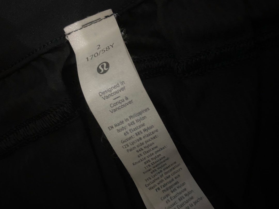 Lululemon Black Athletic Pants Drawstring Size 2 (Category: Joggers) located in Manila. Submitted by switchcity (Listing ID 1466731506, Image 2). Description: - Brand: Lululemon - Size: 2 - Color: Black - Features: Drawstring waist with branded metal aglets, textured fabric, side pockets, and a subtle reflective logo - Condition: Great piece, ideal for workouts or casual wear.