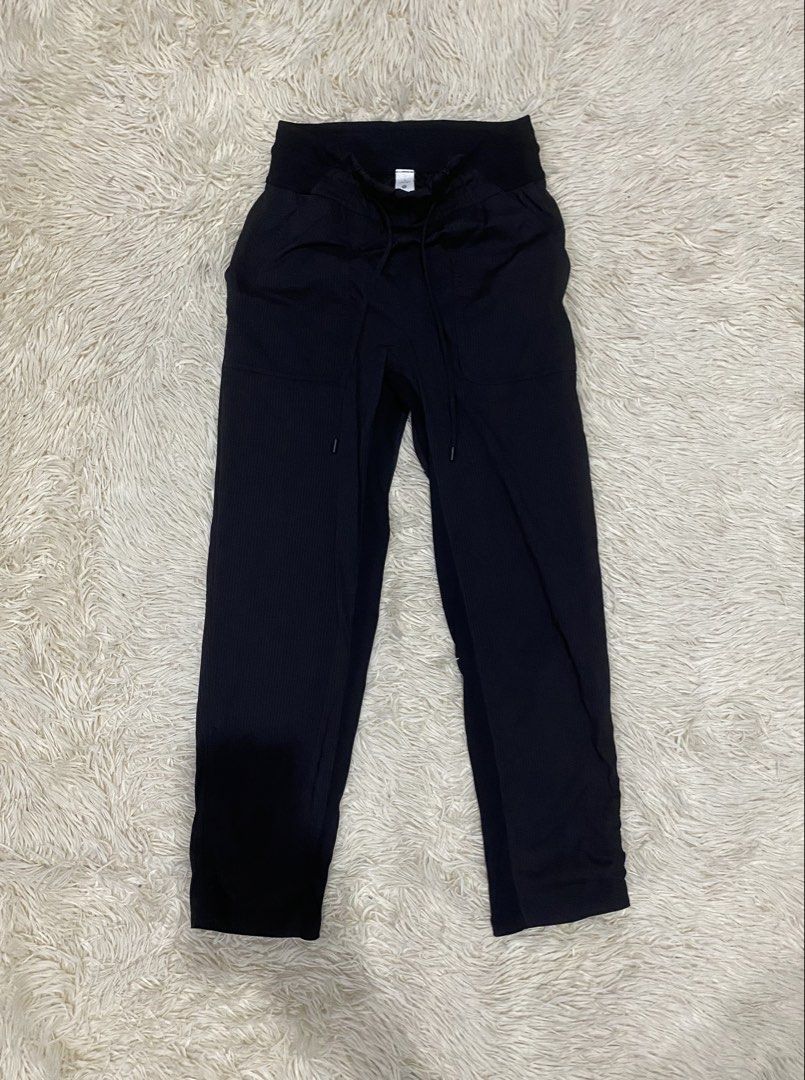 Lululemon Black Athletic Pants Drawstring Size 2 (Category: Joggers) located in Manila. Submitted by switchcity (Listing ID 1466731506, Image 1). Description: - Brand: Lululemon - Size: 2 - Color: Black - Features: Drawstring waist with branded metal aglets, textured fabric, side pockets, and a subtle reflective logo - Condition: Great piece, ideal for workouts or casual wear.