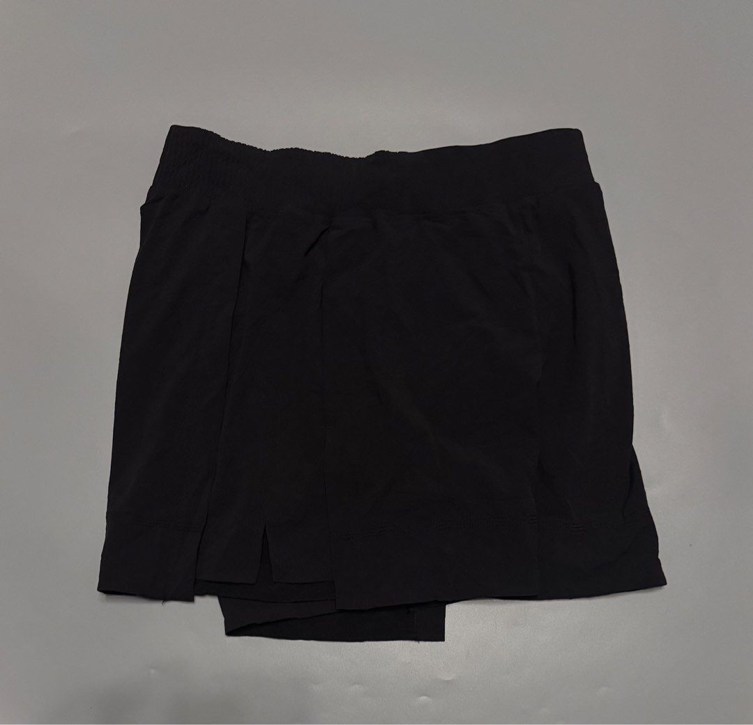 Lululemon Black Athletic Skort Shorts Size M (Category: Shorts) located in Alaminos. Submitted by outfitcheck.ph (Listing ID 1466707722, Image 3). Description: - Brand: Lululemon - Style: Activewear shorts with skirt overlay - Color: Classic Black - Size: M (inner care label) - Features: Breathable fabric, comfortable elastic waistband, and built-in liner - Details: Iconic heat-pressed logo on the back - Best for: Running, tennis, gym workouts, o
