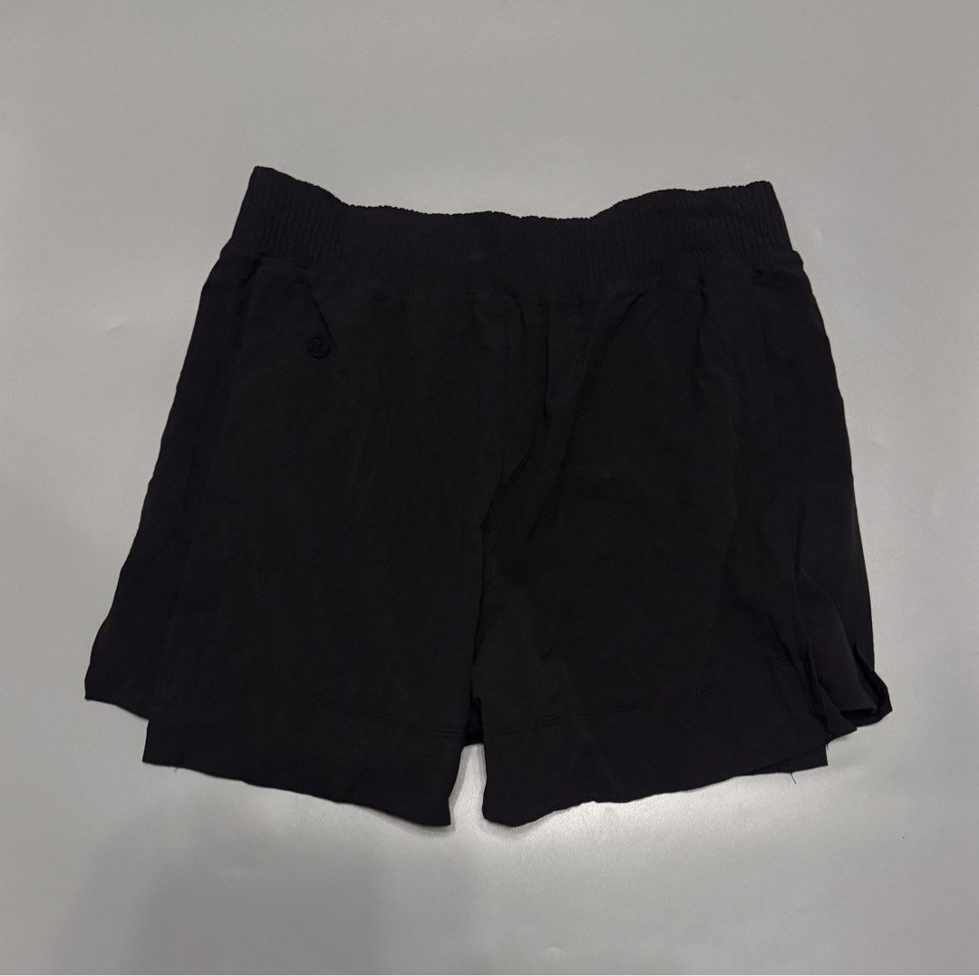 Lululemon Black Athletic Skort Shorts Size M (Category: Shorts) located in Alaminos. Submitted by outfitcheck.ph (Listing ID 1466707722, Image 2). Description: - Brand: Lululemon - Style: Activewear shorts with skirt overlay - Color: Classic Black - Size: M (inner care label) - Features: Breathable fabric, comfortable elastic waistband, and built-in liner - Details: Iconic heat-pressed logo on the back - Best for: Running, tennis, gym workouts, o