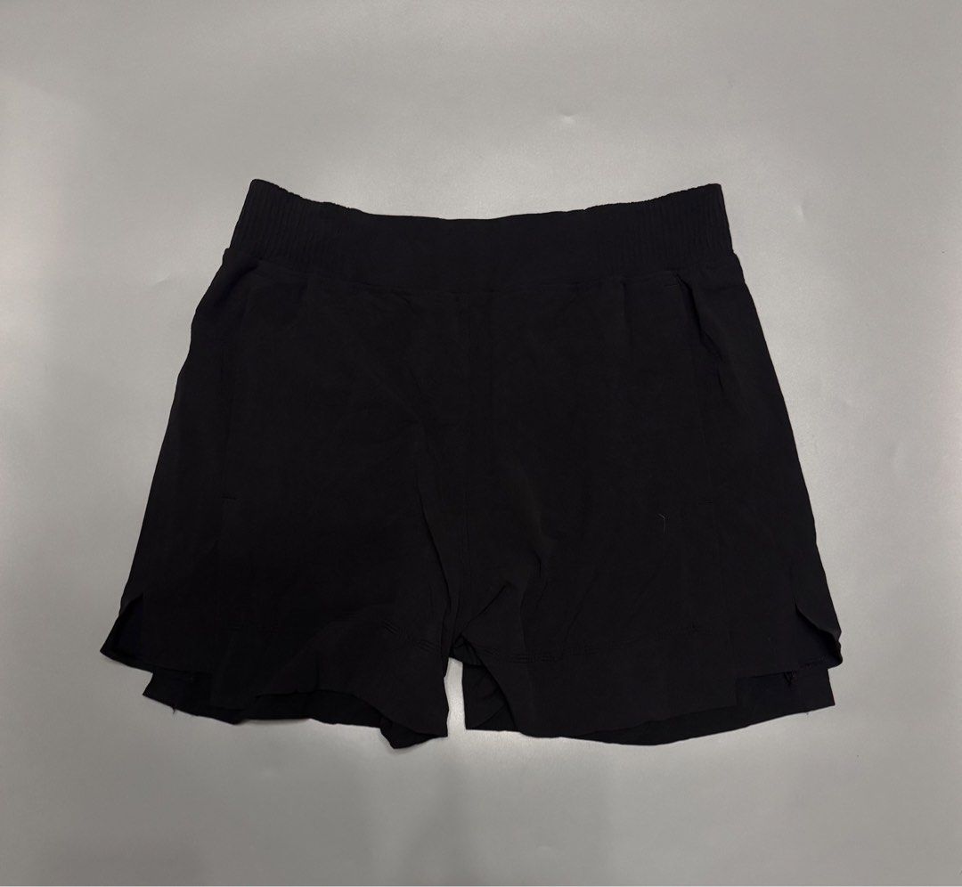 Lululemon Black Athletic Skort Shorts Size M (Category: Shorts) located in Alaminos. Submitted by outfitcheck.ph (Listing ID 1466707722, Image 1). Description: - Brand: Lululemon - Style: Activewear shorts with skirt overlay - Color: Classic Black - Size: M (inner care label) - Features: Breathable fabric, comfortable elastic waistband, and built-in liner - Details: Iconic heat-pressed logo on the back - Best for: Running, tennis, gym workouts, o